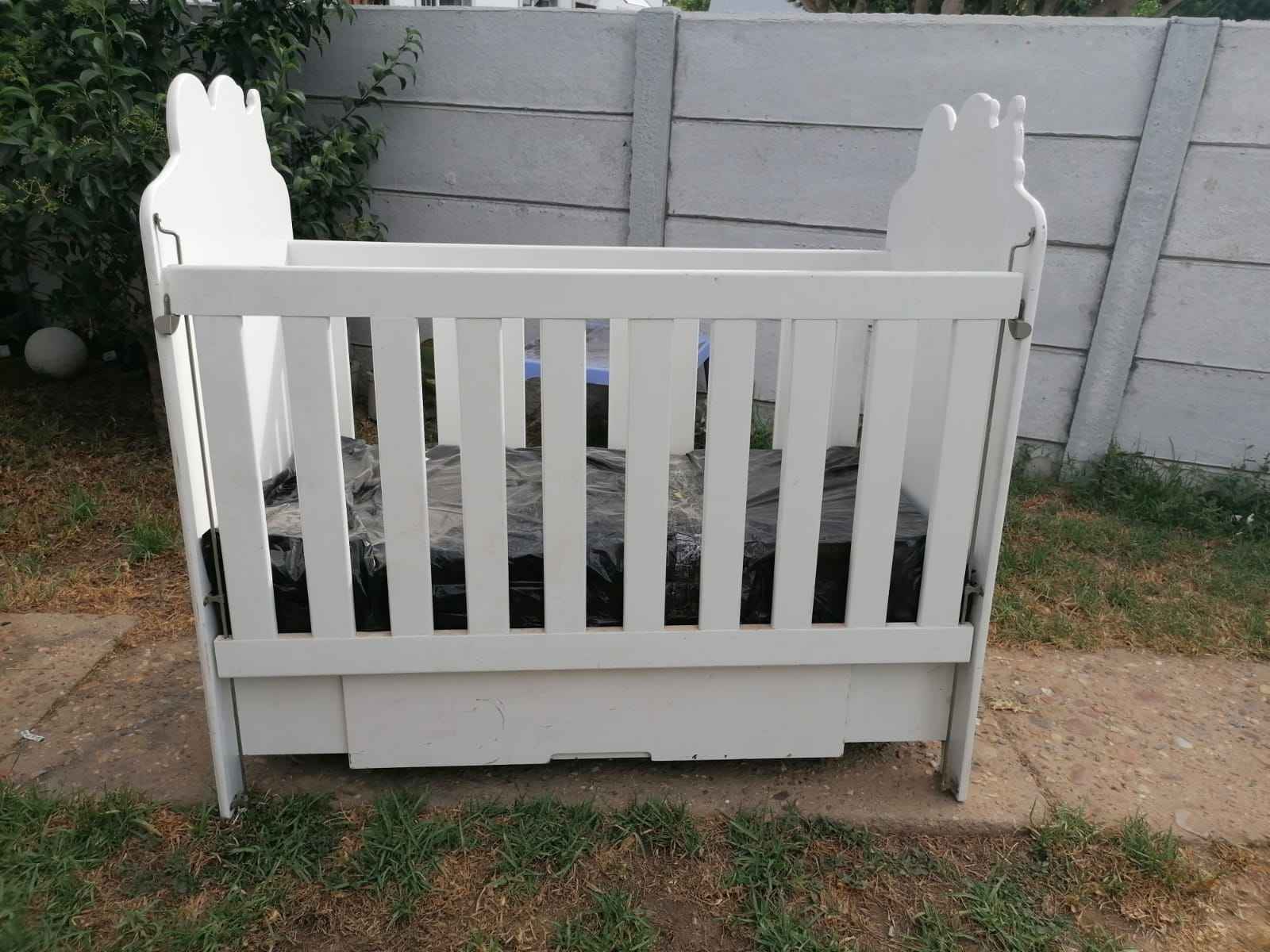 White wooden cot