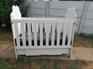 White wooden cot